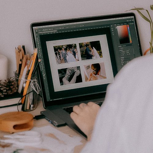 R&R Photography editing wedding photos on laptop